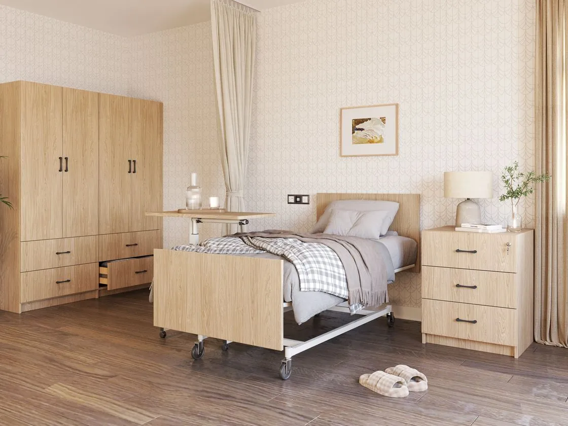 Complete resident room set: wardrobe, bed, night table, and overbed tray in warm oak